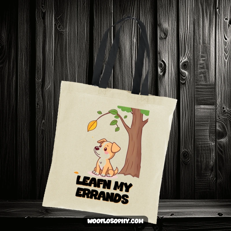 Funny tote bag featuring a dog character pondering a falling leaf, a humorous representation of autumn reflection.